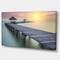 Designart - Wooden Sea Bridge and Sunset - Seashore Photo Canvas Print